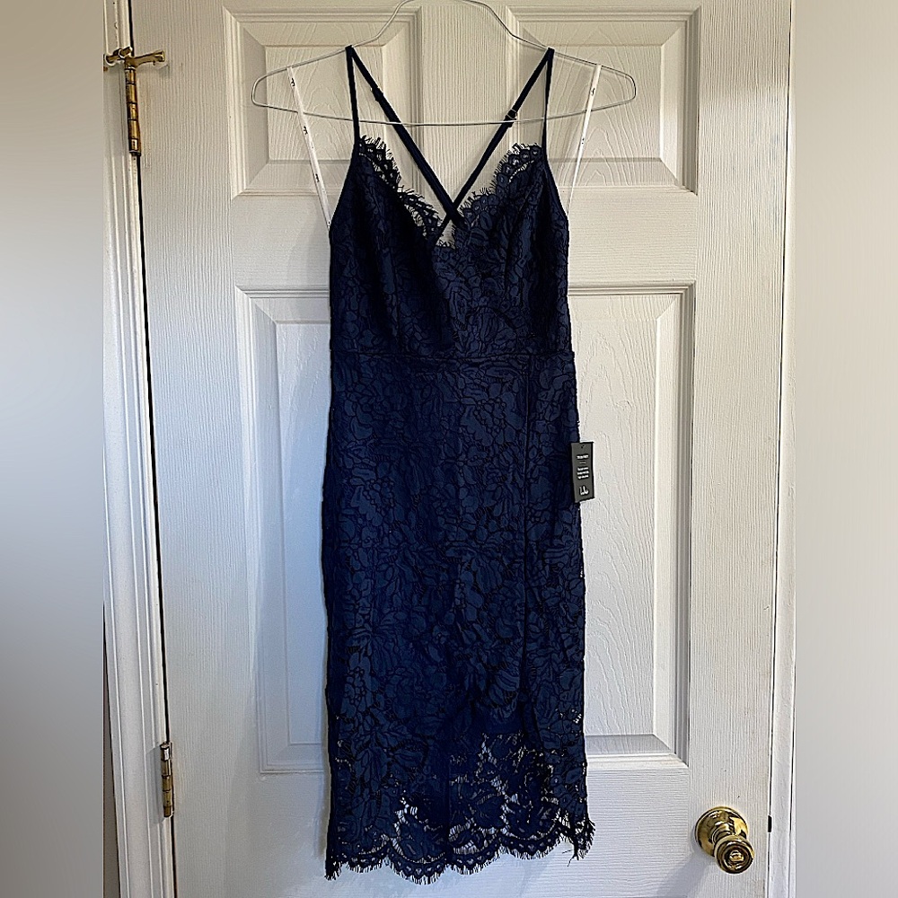 NWT Navy Lace Knee Length Dress with side slit and open back - size small
